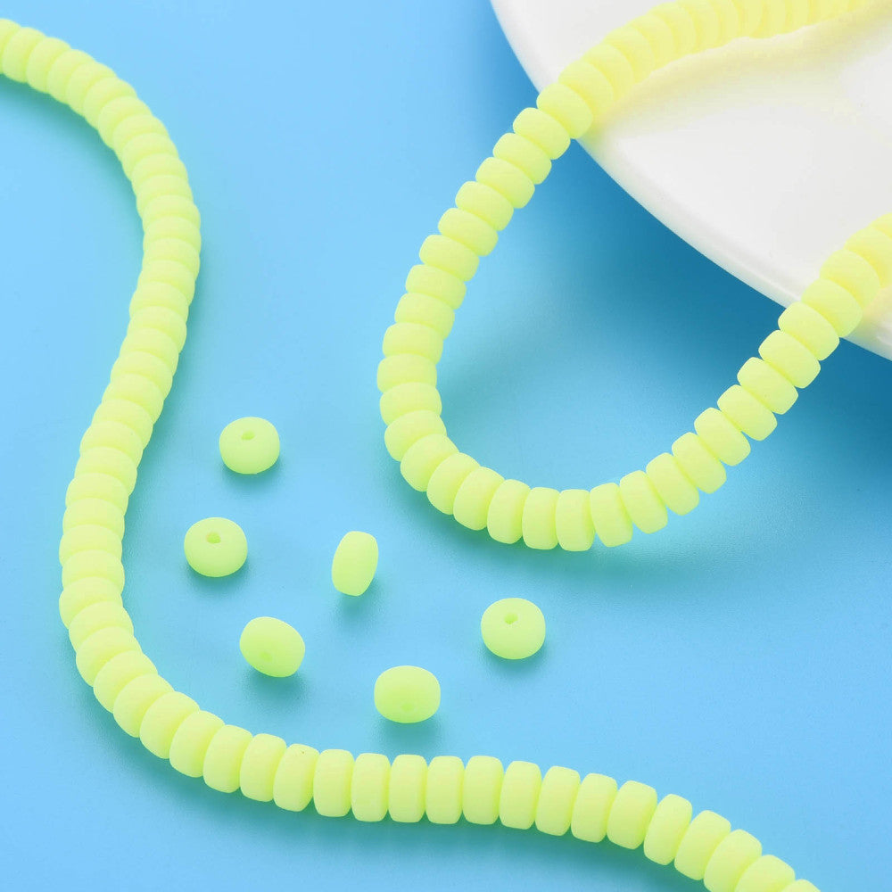 Yellow flat round polymer clay bead strand with loose beads, small round disc beads