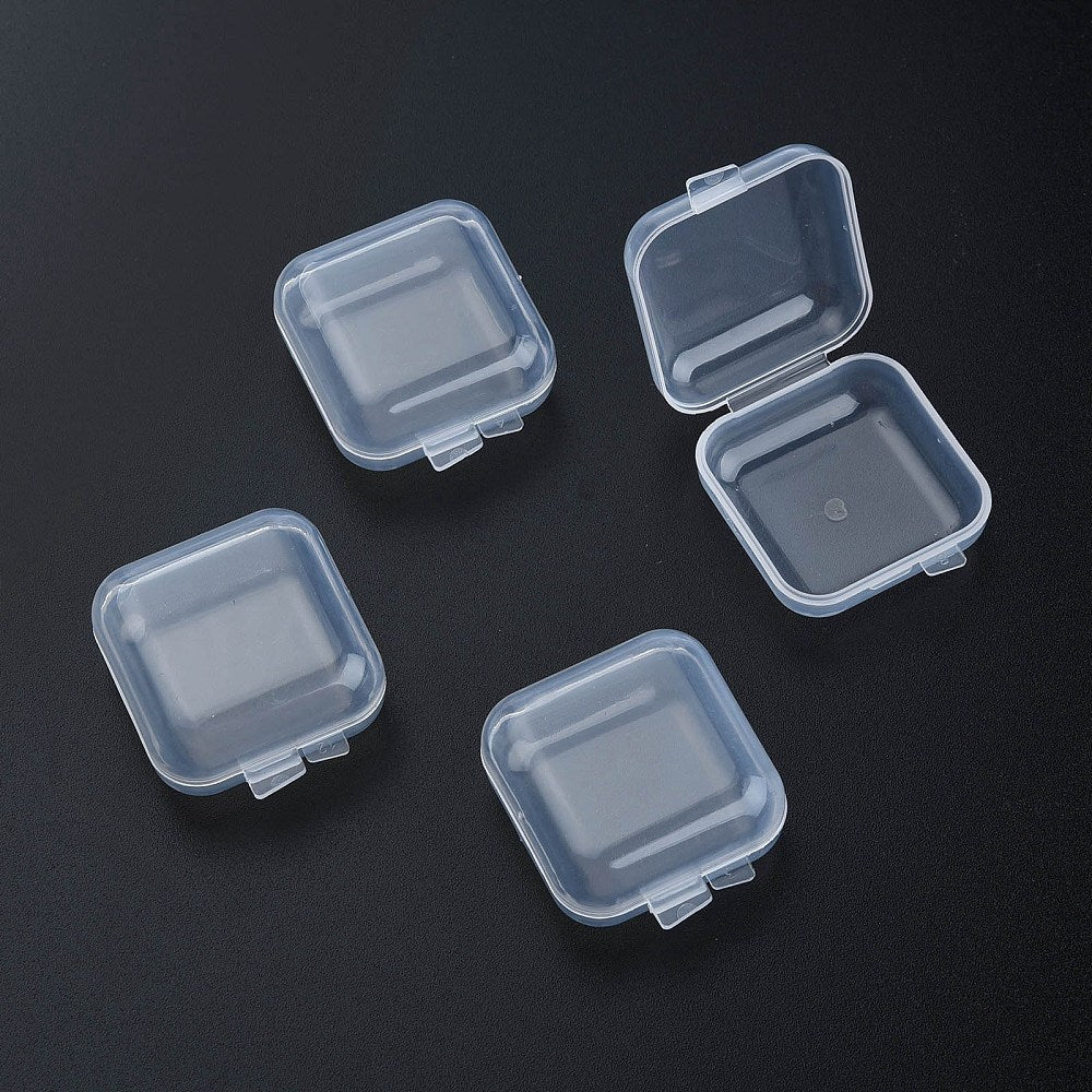 Set of four clear plastic bead storage containers with hinged snap lids