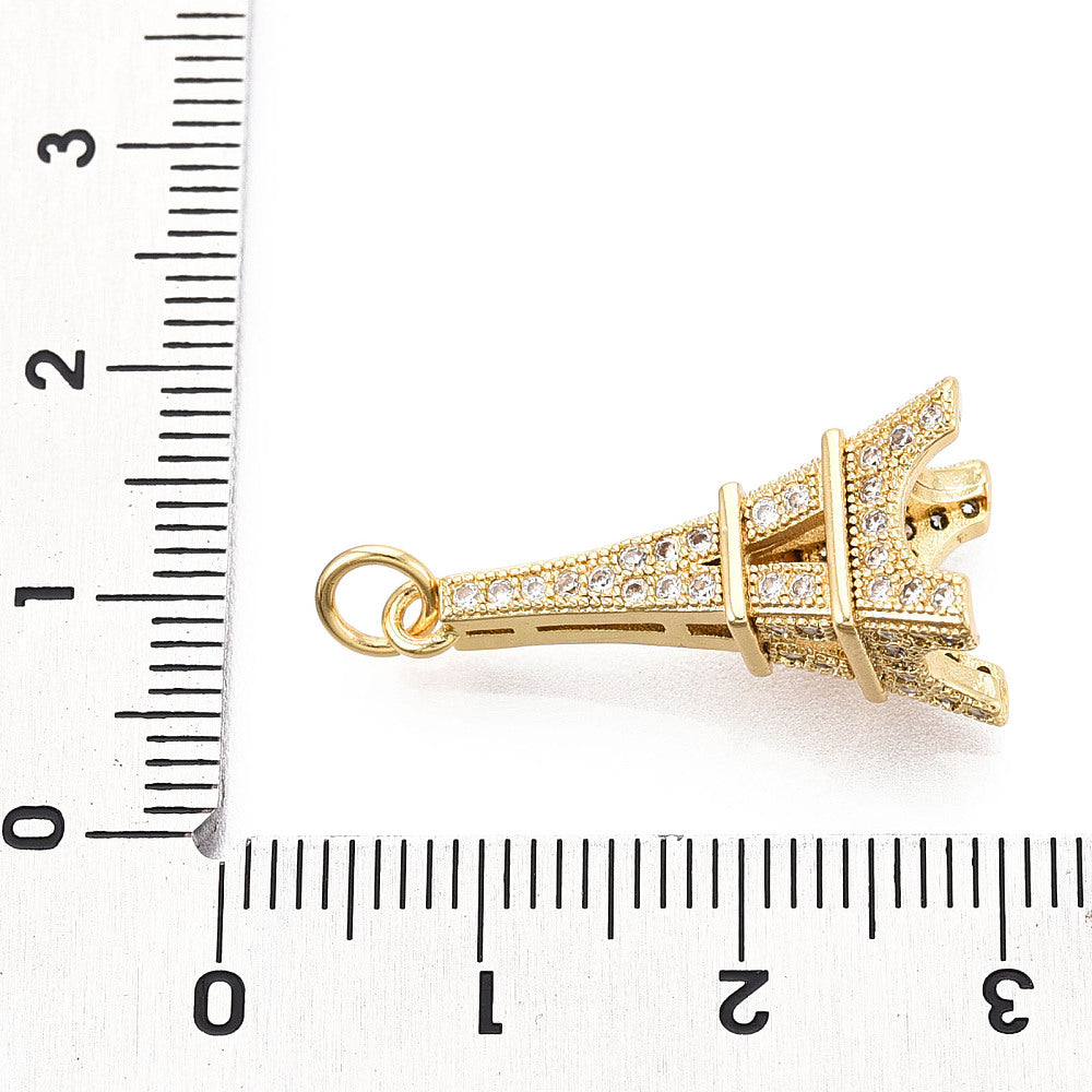 Eiffel tower pendant with gold-tone jump ring and micro-pavé CZ stones, side view