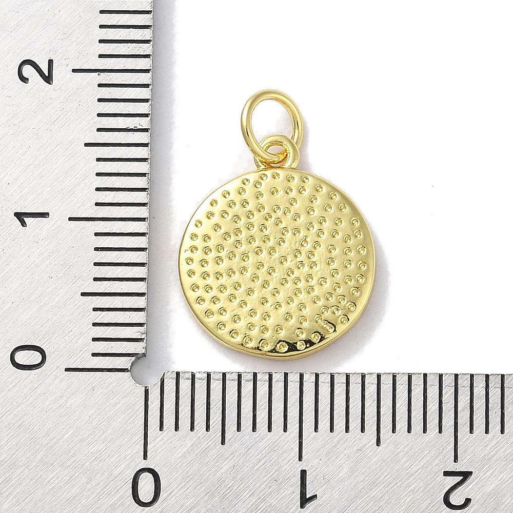 Round gold-tone pendant back with textured dots and bail loop