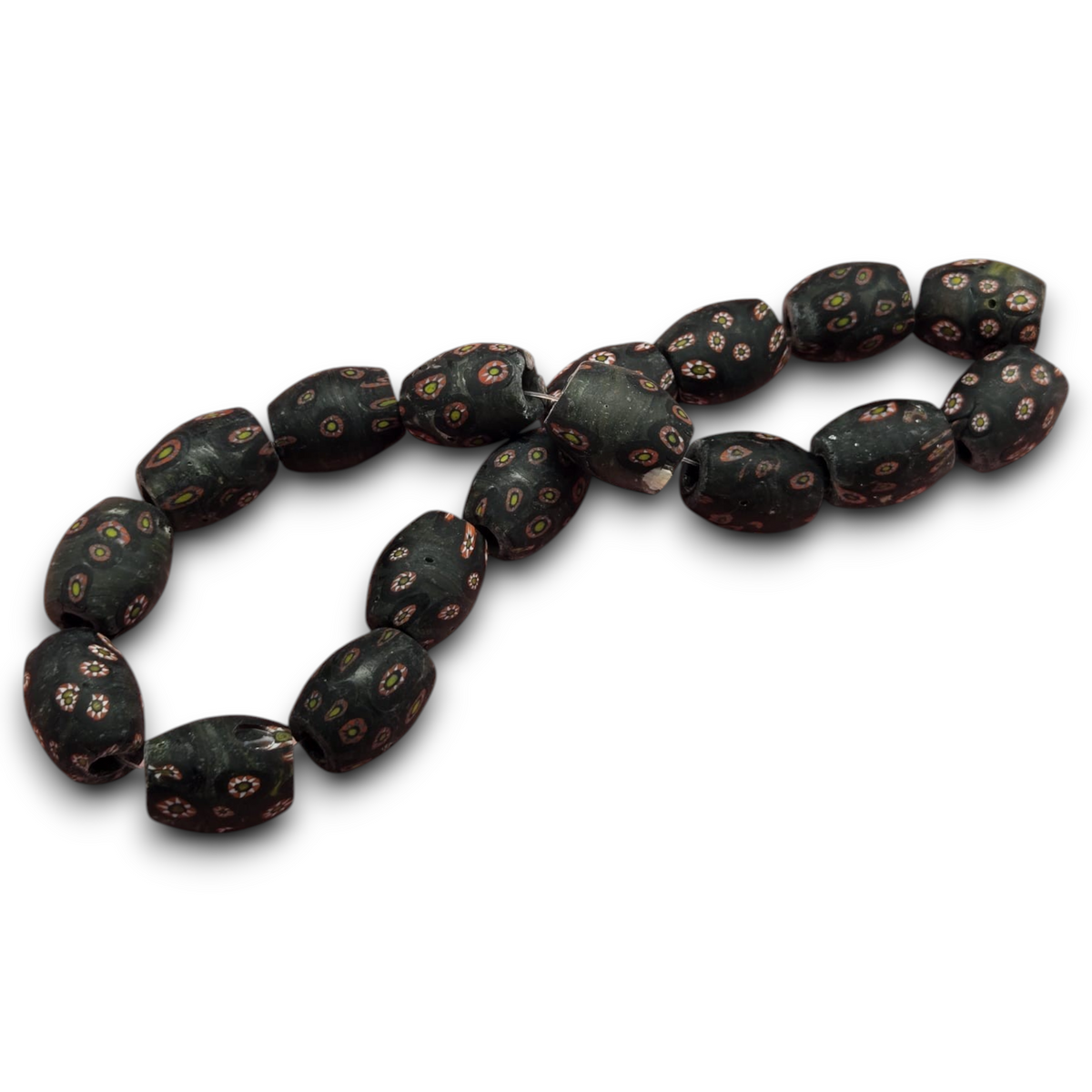 Matte vintage glass barrel beads with dark base and colorful millefiori dot pattern.