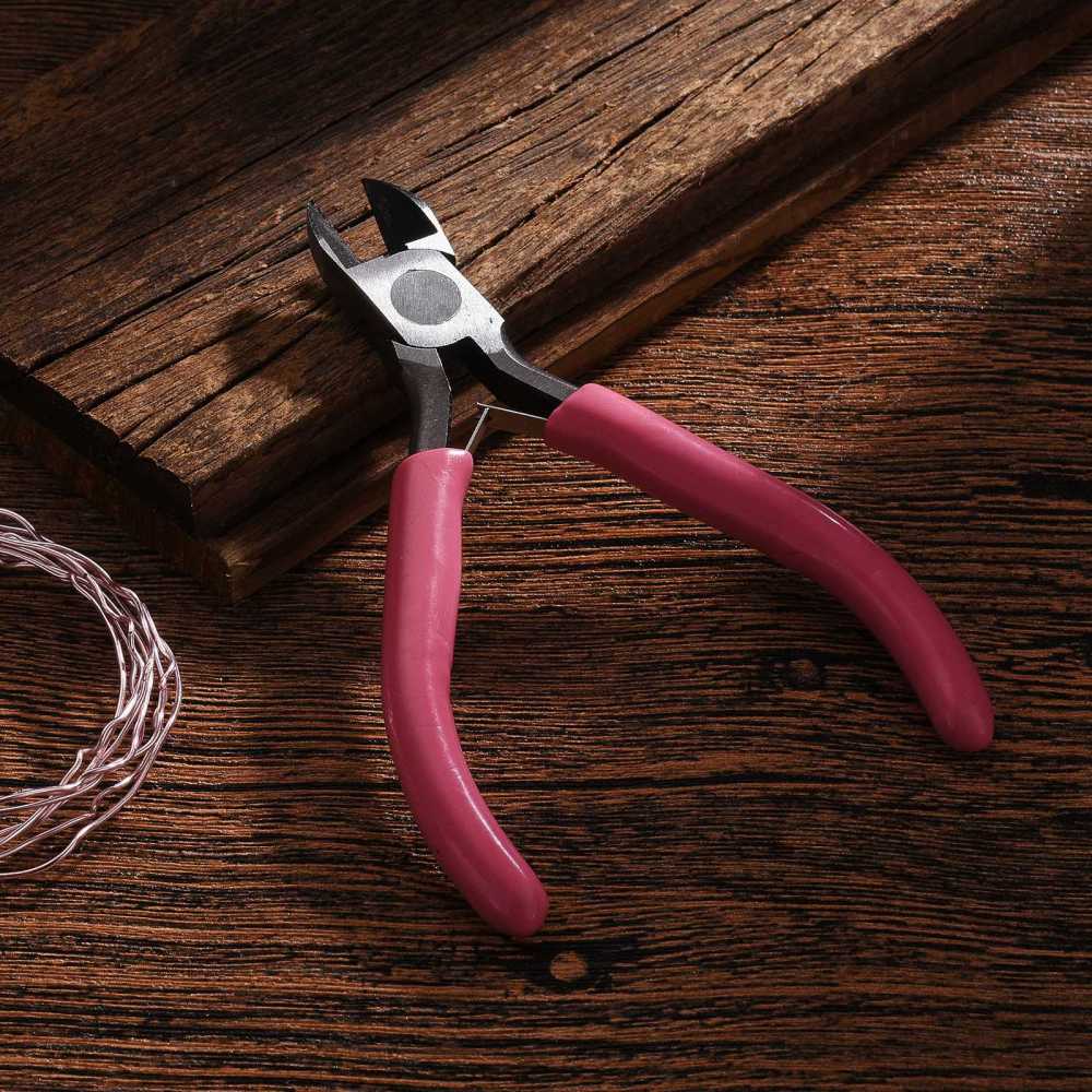 Side-cutting pliers with maroon rubber handles and angled cutter jaws