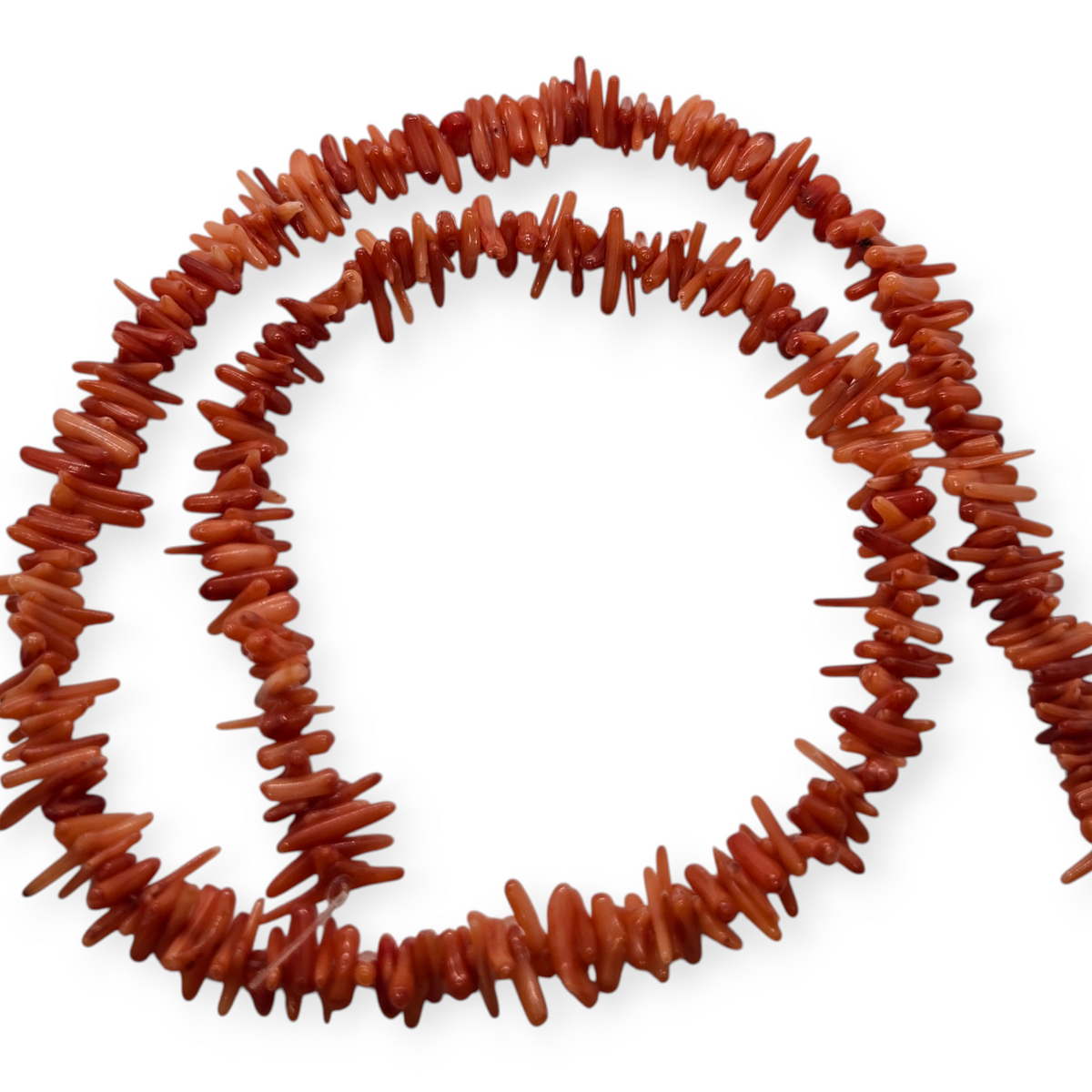 Red bamboo coral bead strand, loop of small cylindrical beads