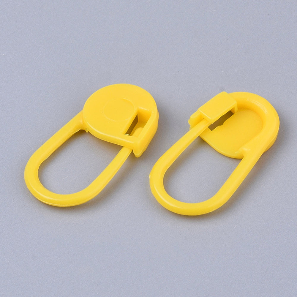 Yellow plastic locking stitch markers, two U-shaped clips