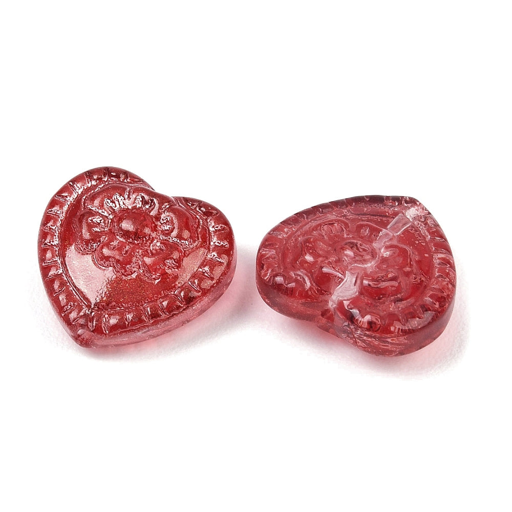 Glass heart beads with raised floral design, firebrick red, close-up of two hearts