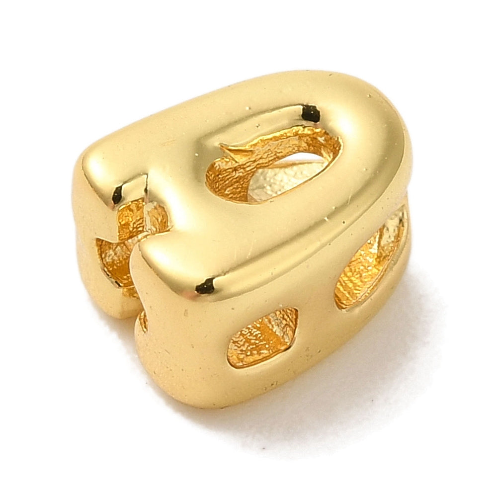 Gold-plated brass letter A charm, side view with raised details