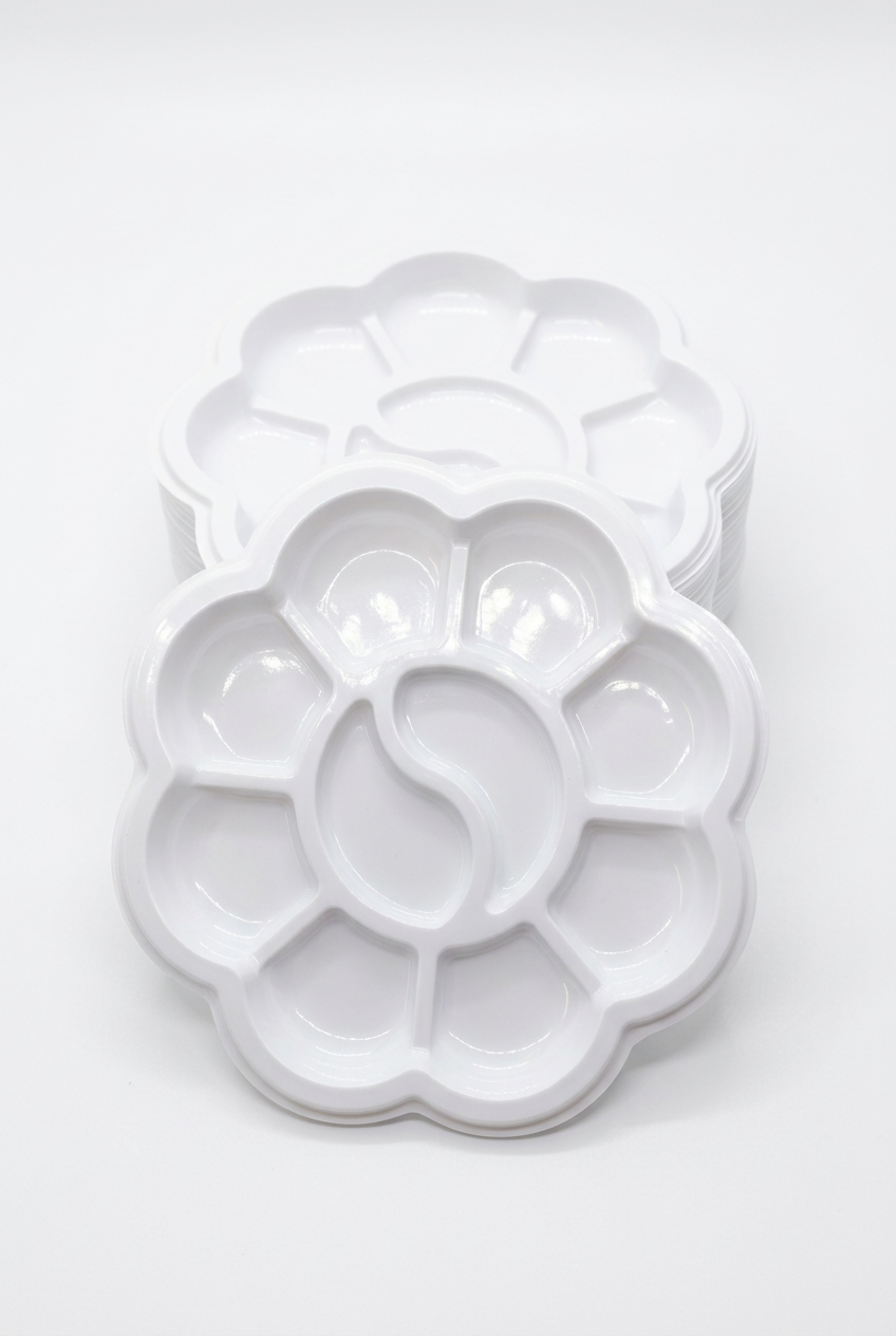Small white flower-shaped paint palette tray with multiple color wells