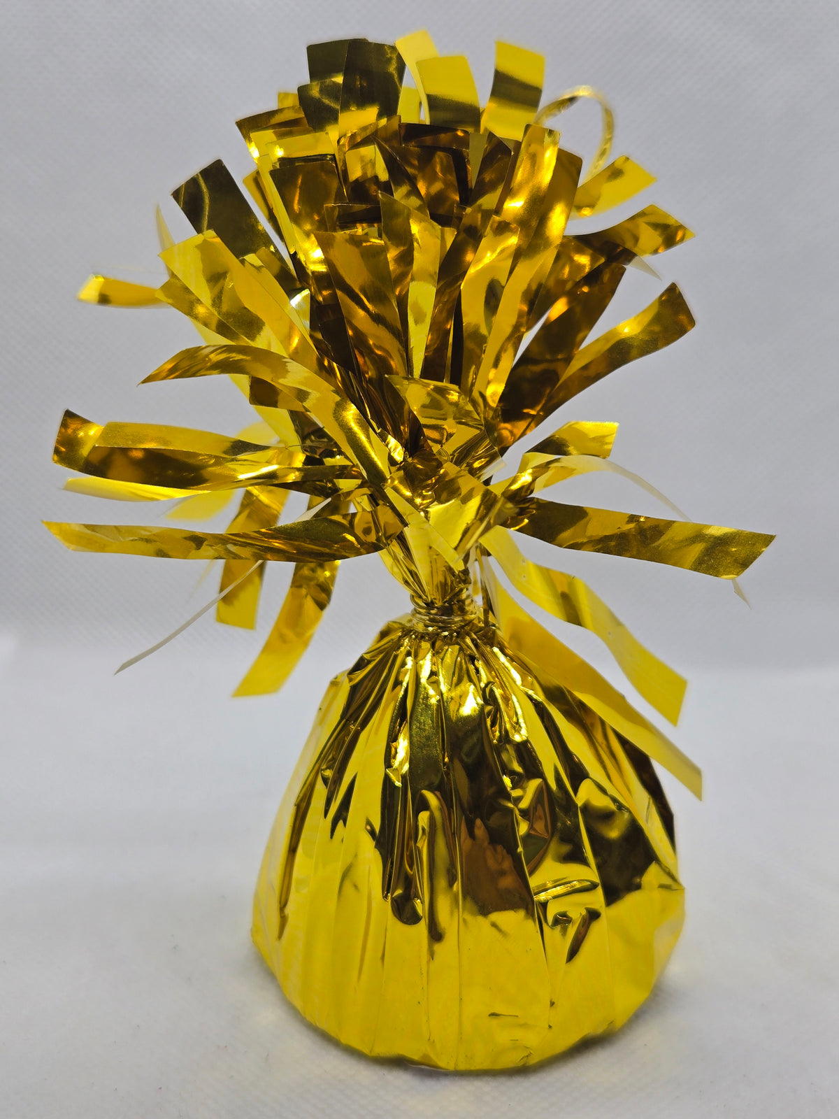 Gold foil balloon weight with crinkled ribbon top