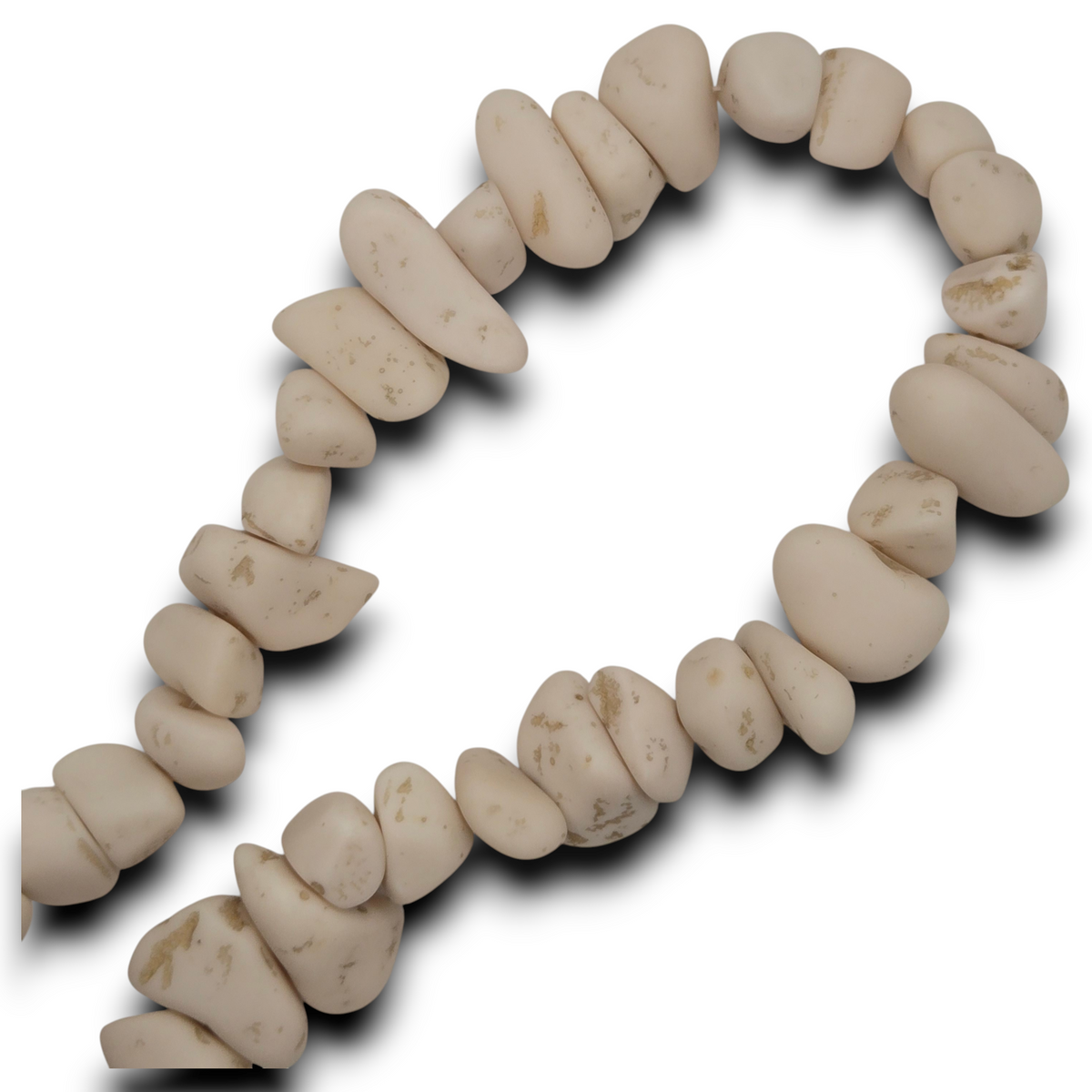 Cream chip resin beads strand looped in circle, smooth oval chips with speckles