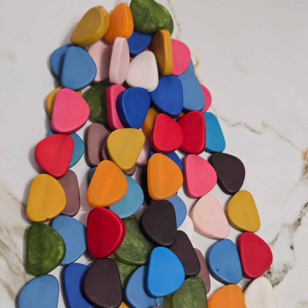 Assorted flat triangle resin beads in red blue green orange pink and yellow