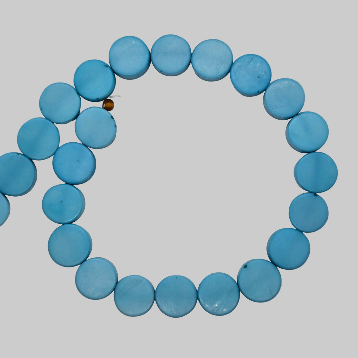 Light blue flat rondelle resin beads strand, looped circle of round disc beads