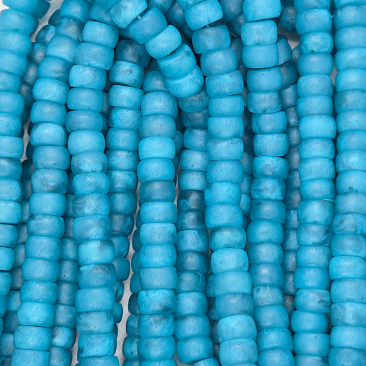 Matte teal rondelle resin beads, close-up of stacked beads