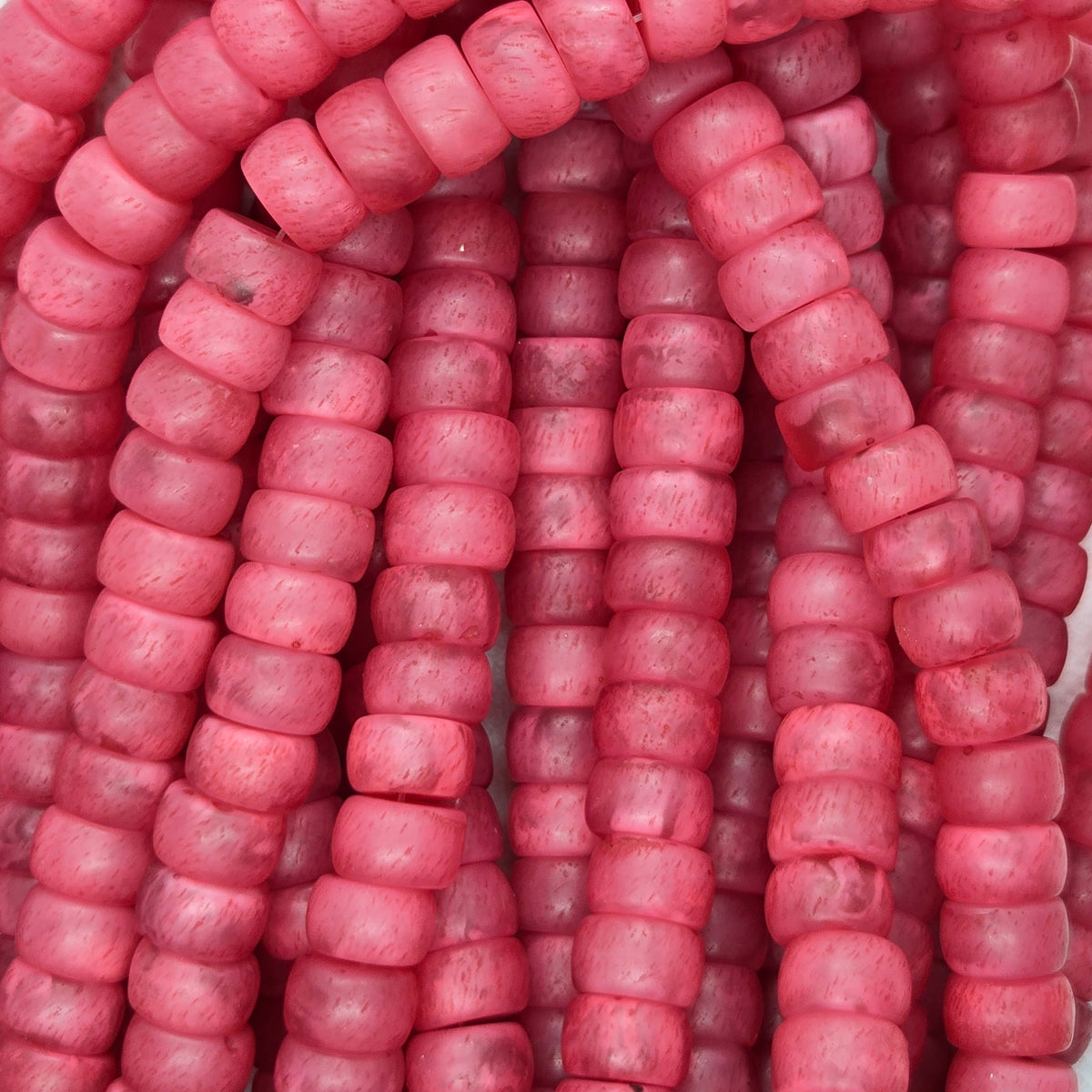 Pink rondelle resin beads strand, tightly packed small rounded beads