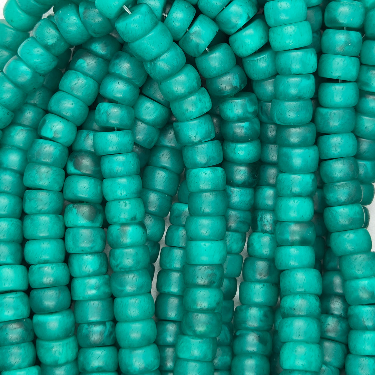 Green rondelle resin beads strand, small rounded cylinder beads with glossy textured finish