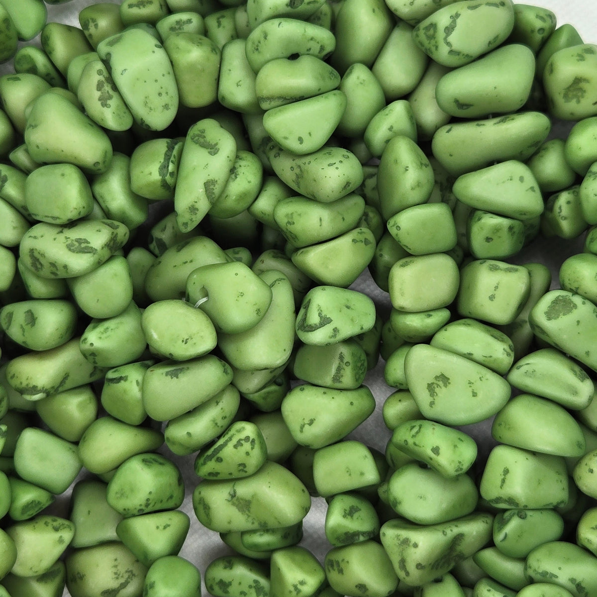 Green resin chip beads strand with irregular shapes, speckled surface