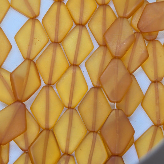 Yellow diamond-shaped resin beads with faceted translucent yellow finish