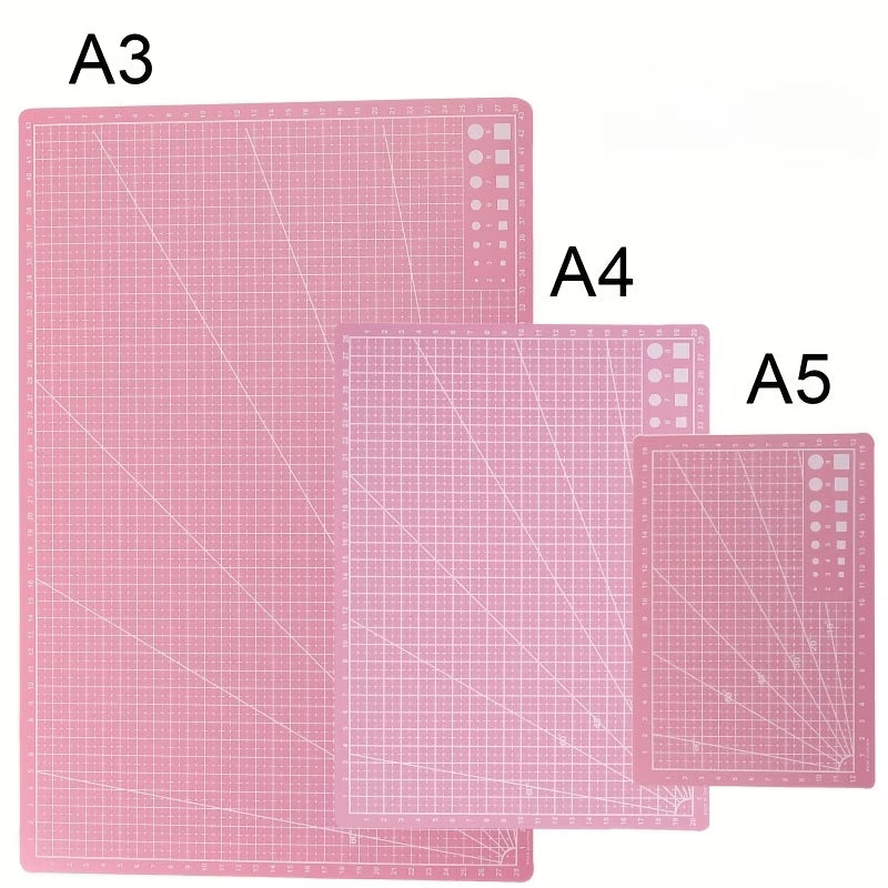 Pink self-healing cutting mats: A3, A4, and A5 with grid and measurement lines