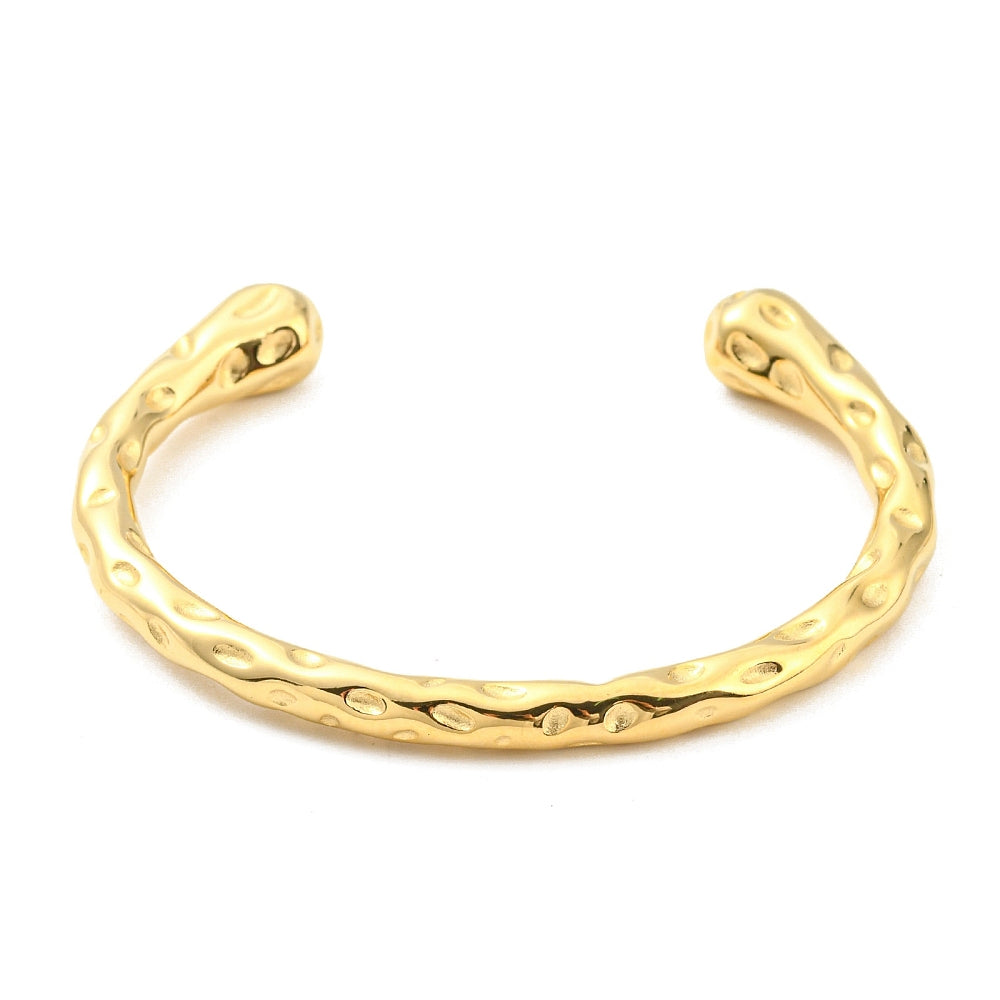 Gold-tone cuff bangle, curved open bracelet with hammered texture and oval motifs