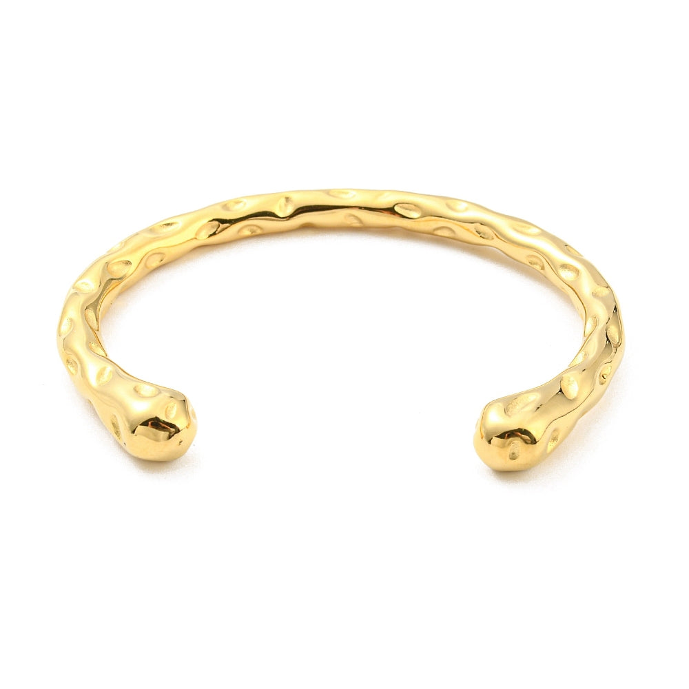 Gold-tone cuff bangle with textured metal and rounded end caps, open cuff bracelet