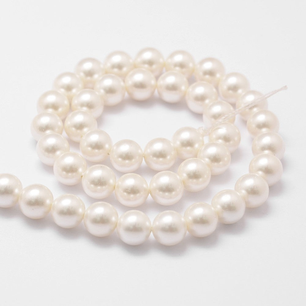 Cream-white round pearl beads strand with visible looping curve