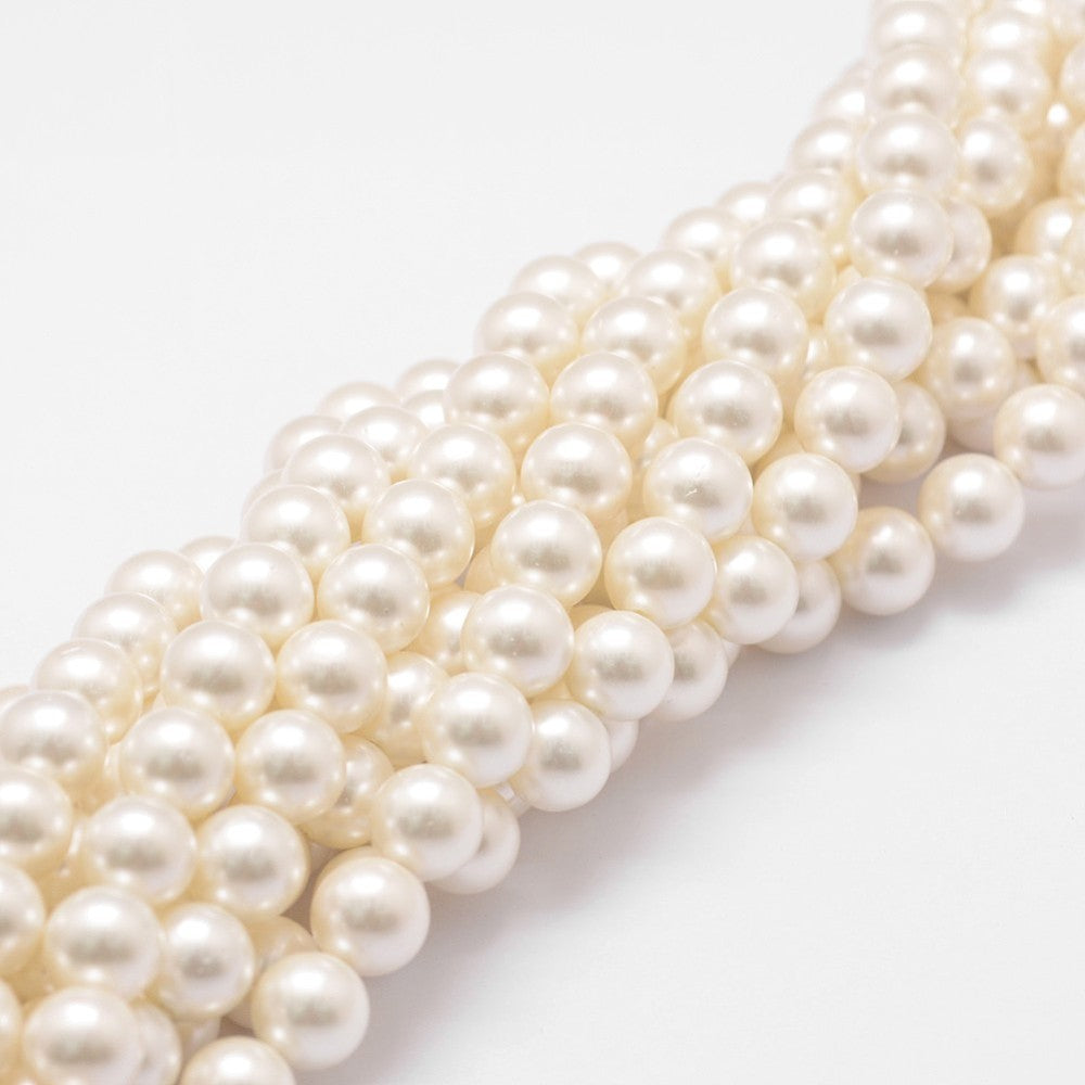 Floral pearl beads strand with round white shell pearls, layered close-up