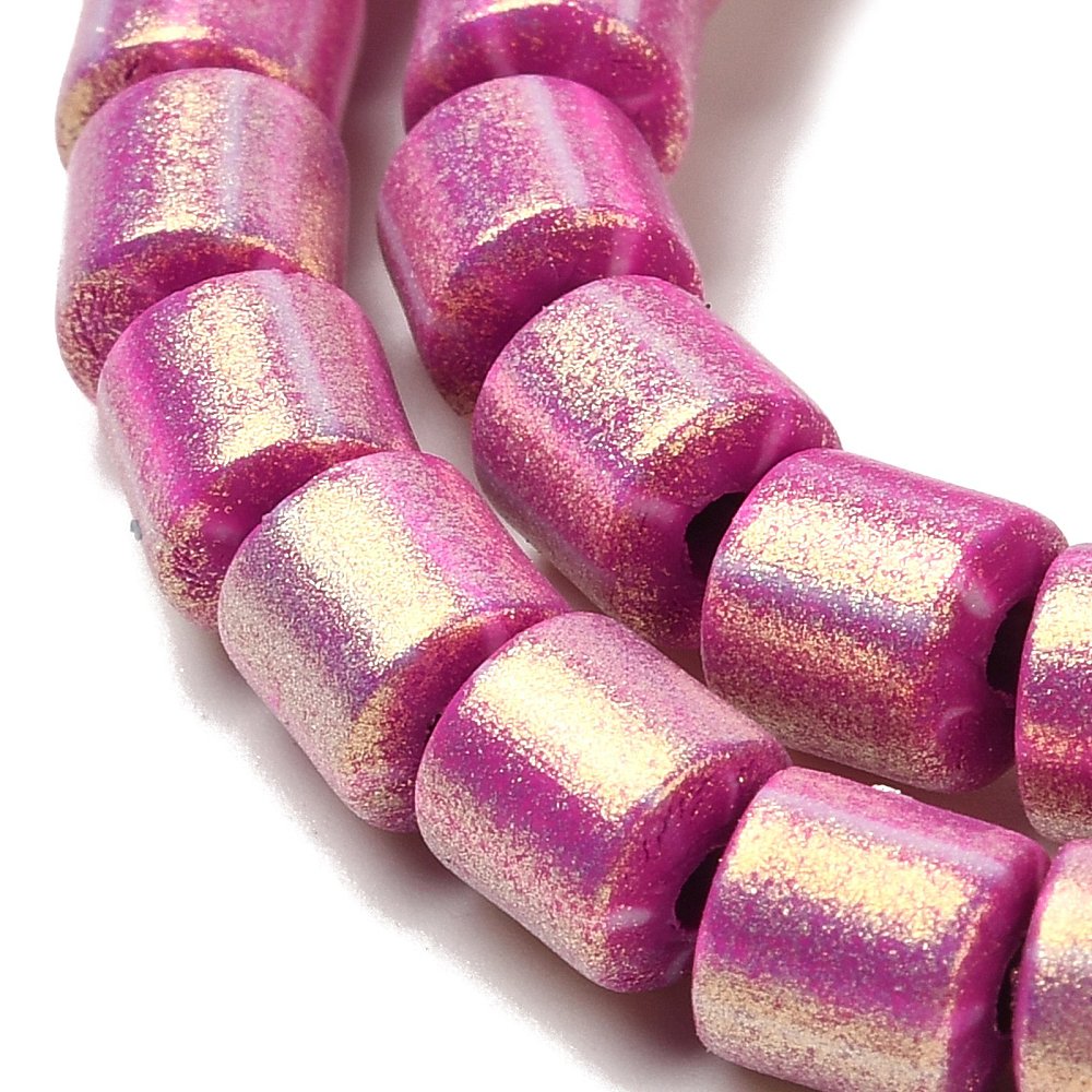 Magenta glitter polymer clay column beads, close-up on cylindrical tubes