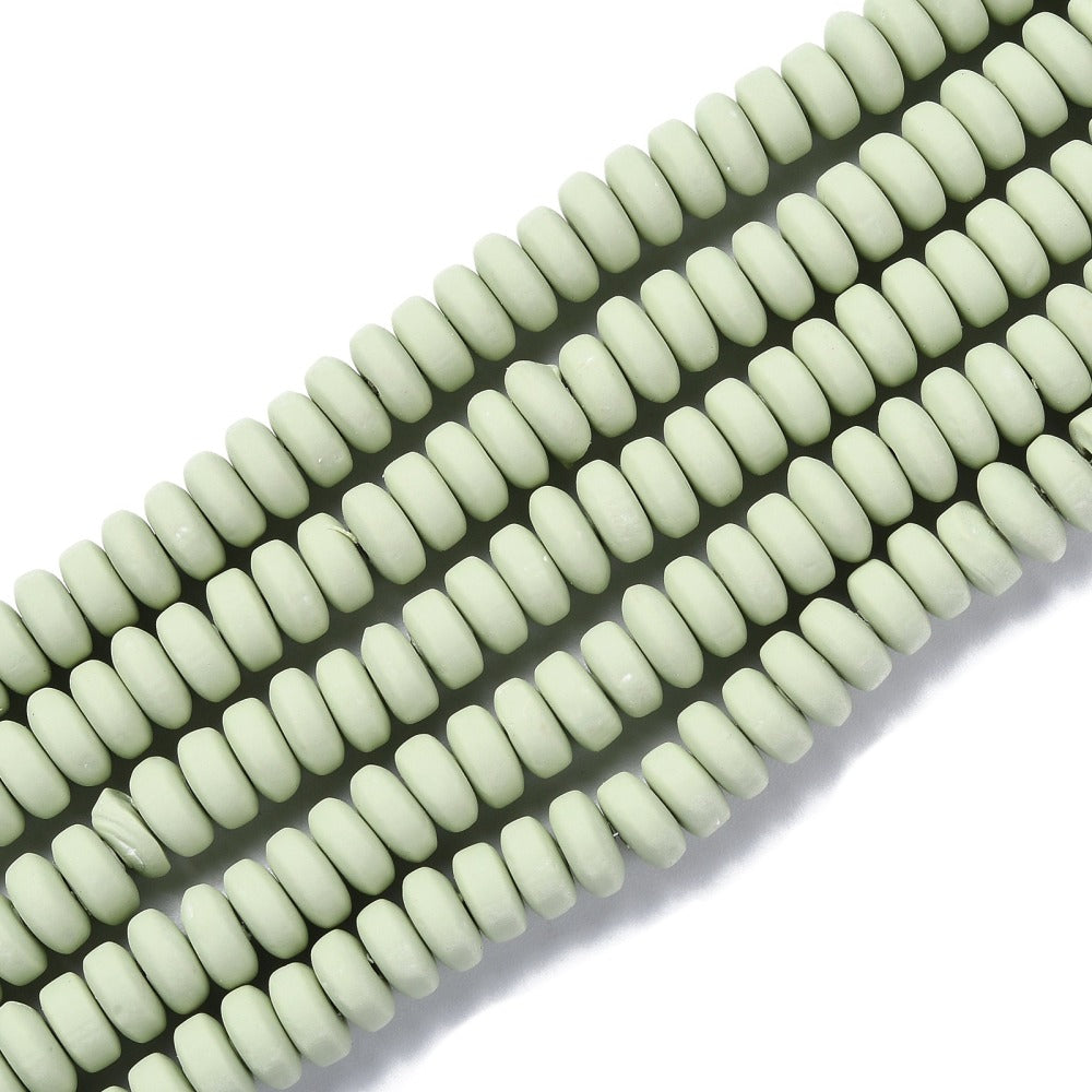 Pale green flat round polymer clay beads strand, side-by-side ridged discs
