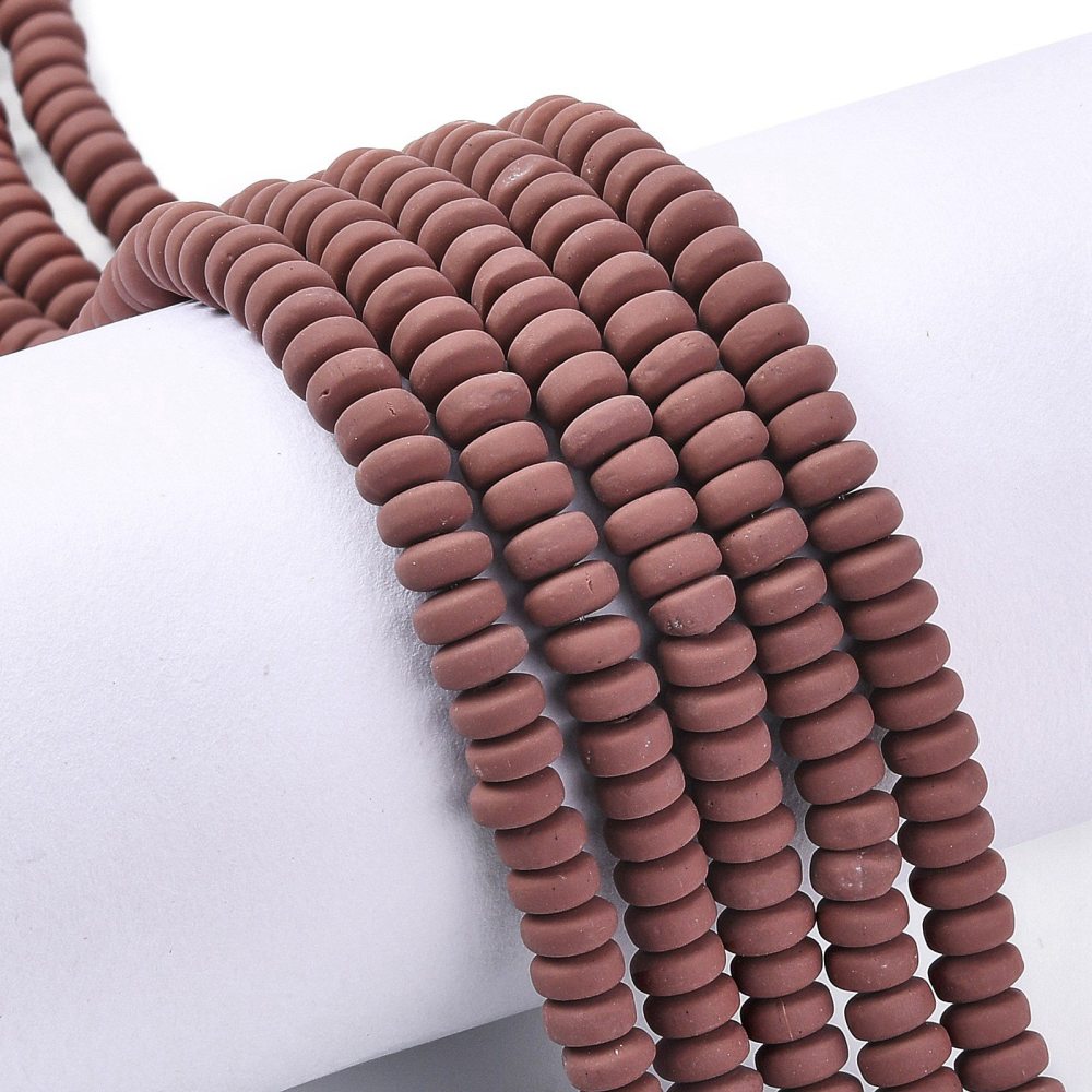 Flat round polymer clay beads strand in saddle brown, stacked view
