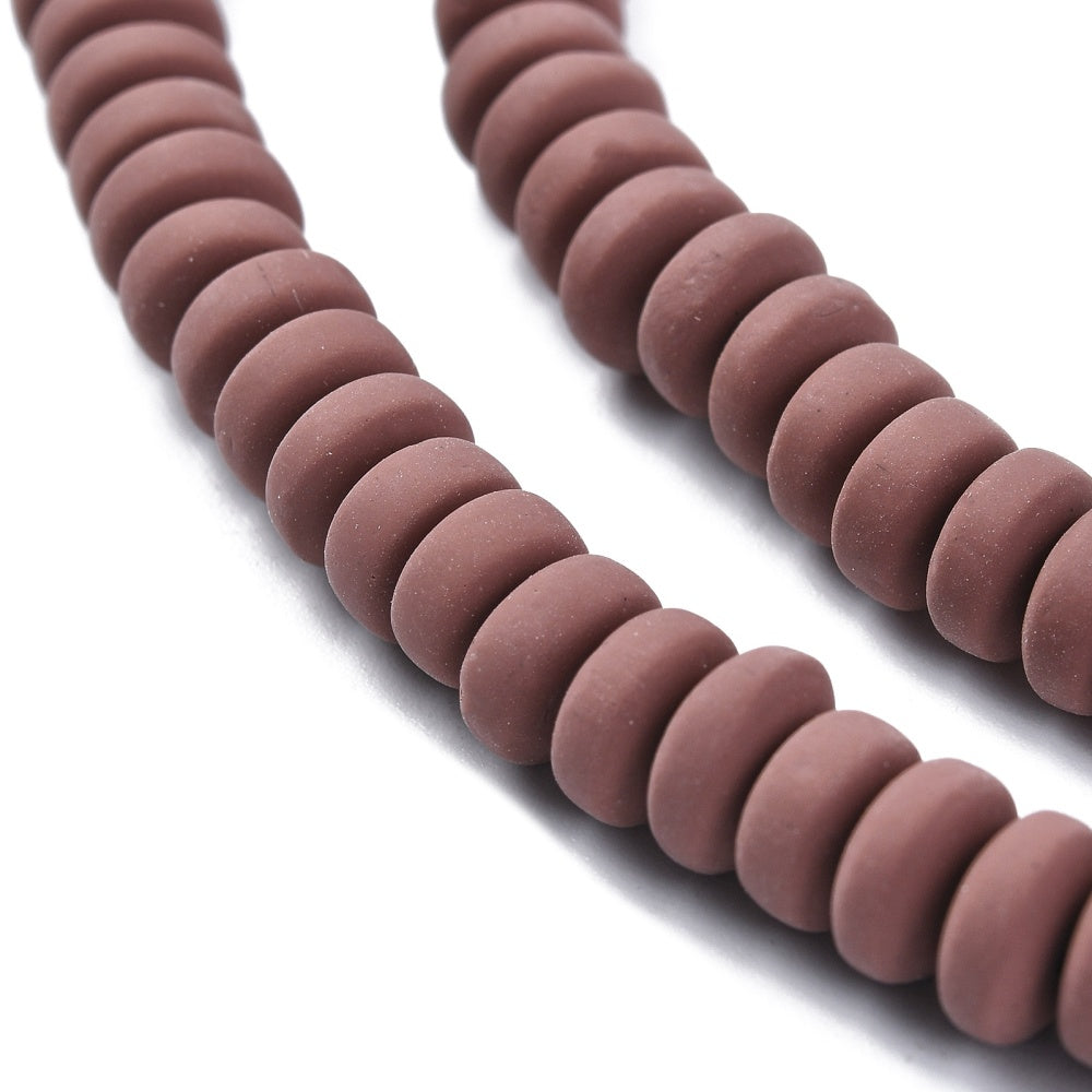 Saddle brown flat round polymer clay beads, close-up of rows