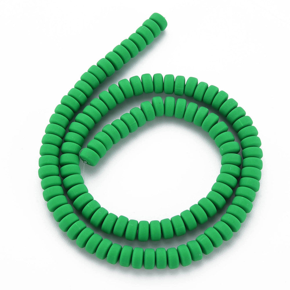Green flat round bead strand looped in a circle, ridged discs with holes