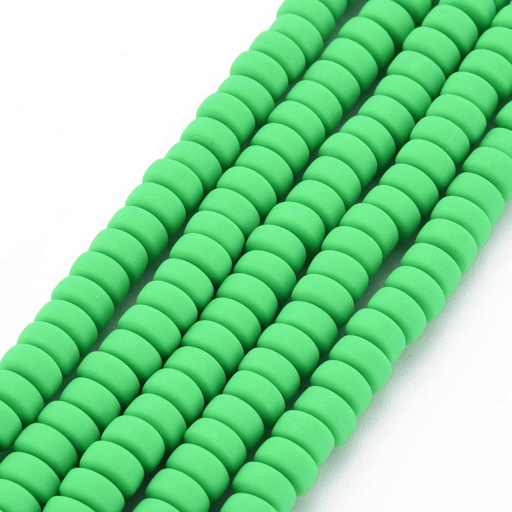 Lime green flat round polymer clay beads strand, close-up of smooth faces, tight spacing