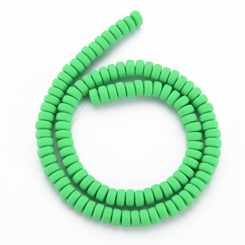 Lime green flat round polymer clay bead strand formed into a circle
