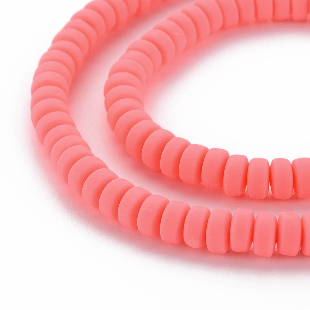 Two strands of flat round polymer clay beads in tomato red, small ribbed discs with holes
