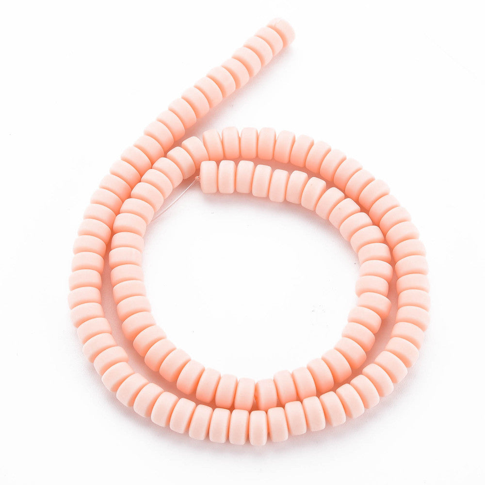 Flat round bead loop strand in pale pink, stacked ridged discs