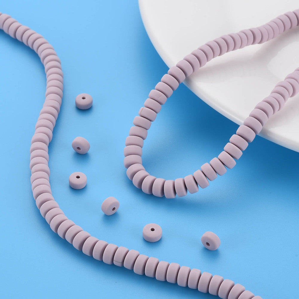 Polymer clay bead strand with loose matching beads, flat round lavender-pink