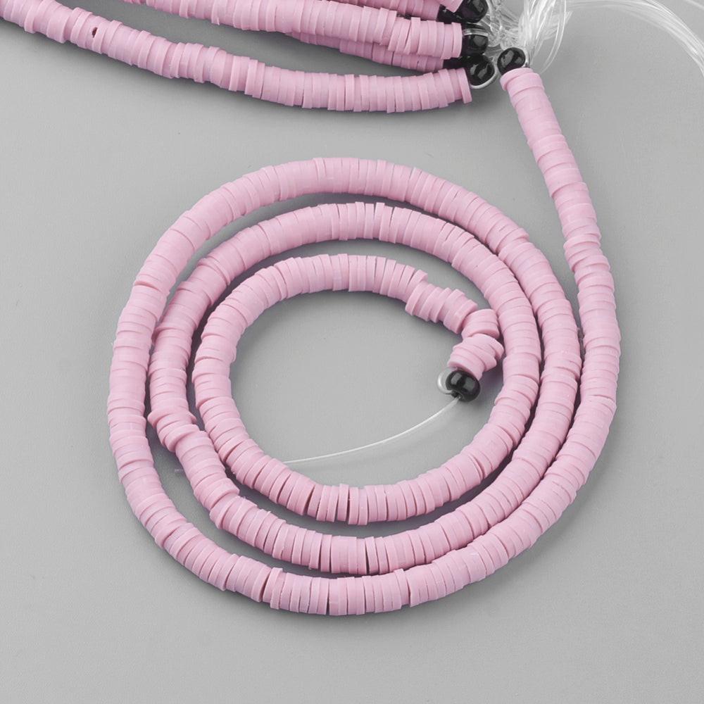 Pink heishi bead strands with small round disc beads and attached elastic cord
