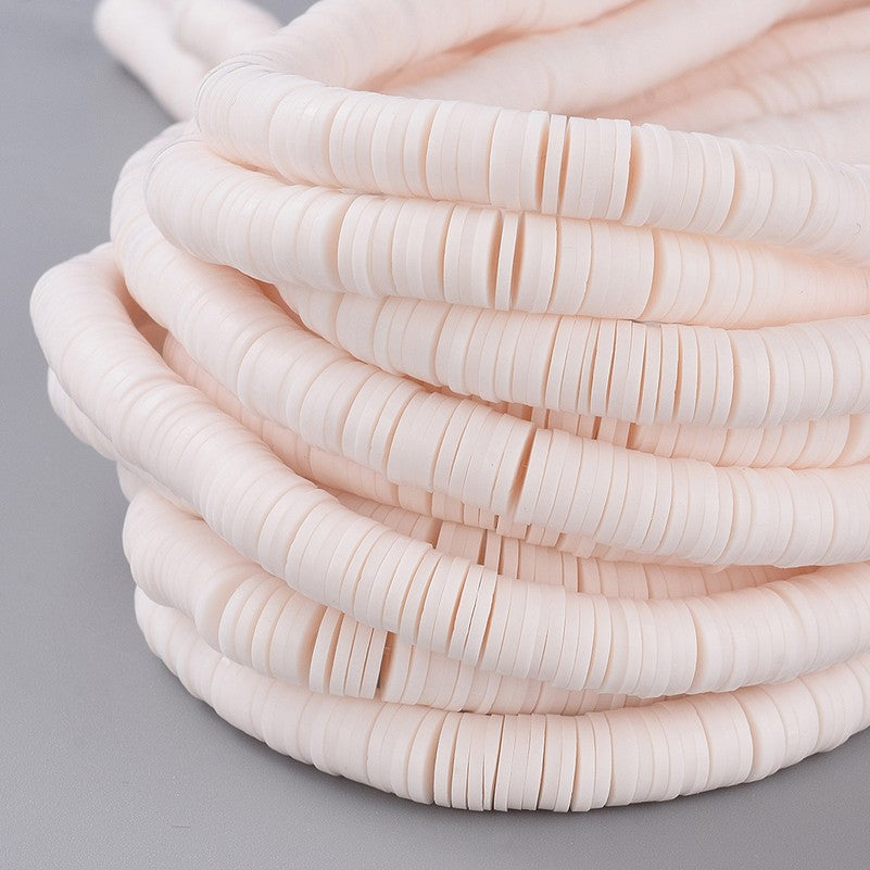Misty rose heishi disc beads strand stacked, smooth round polymer clay beads in coils.