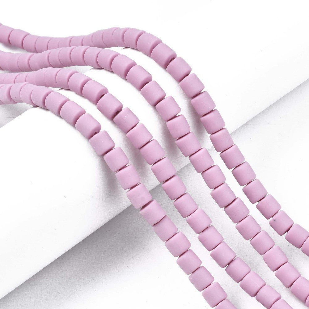 Multiple strands of light purple square-cut polymer clay column beads
