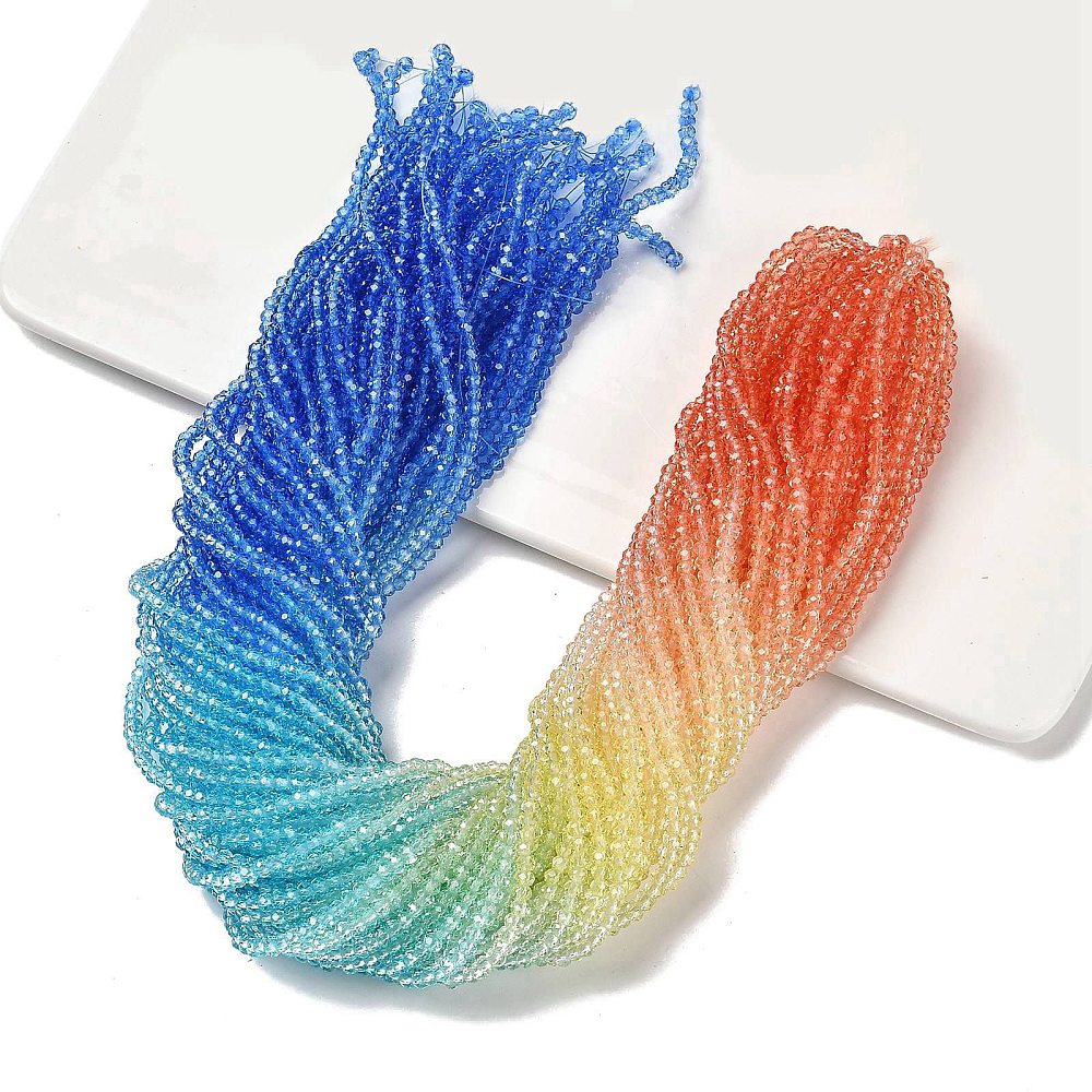 Transparent faceted glass rondelle bead strands, blue-to-aqua-green gradient and peach-to-cream.