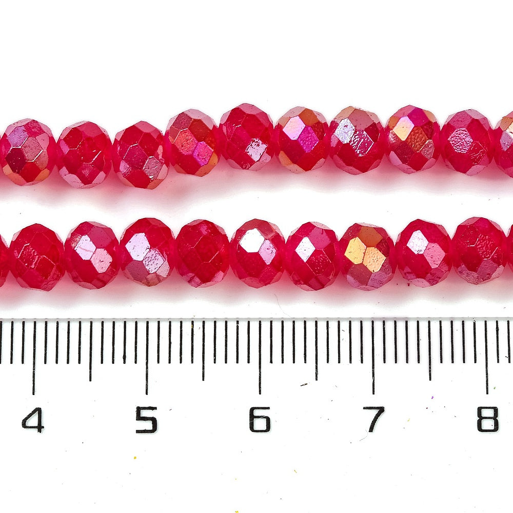 Fuchsia faceted glass rondelle beads with AB metallic sparkle beside size ruler, 10x8mm