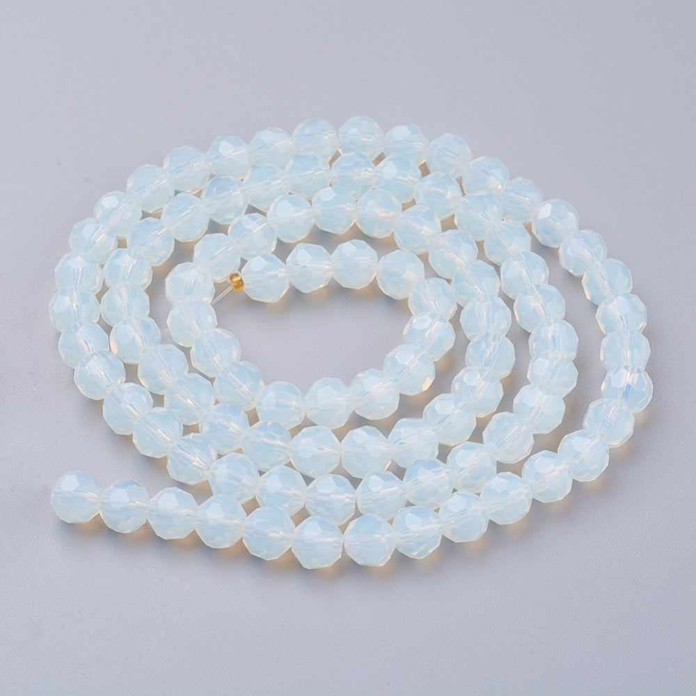 Faceted round opalite bead strand, pale opal blue, coiled view