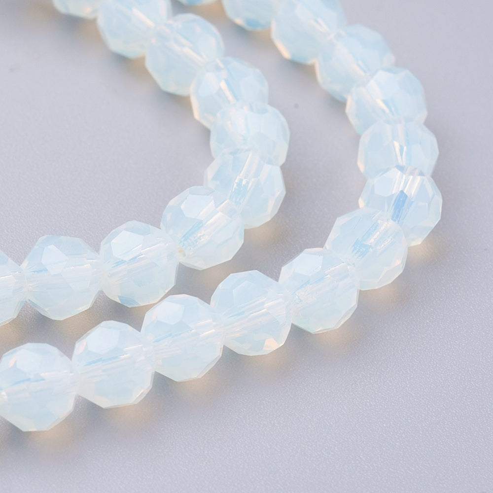 Faceted round opalite beads, pale opal blue, close-up