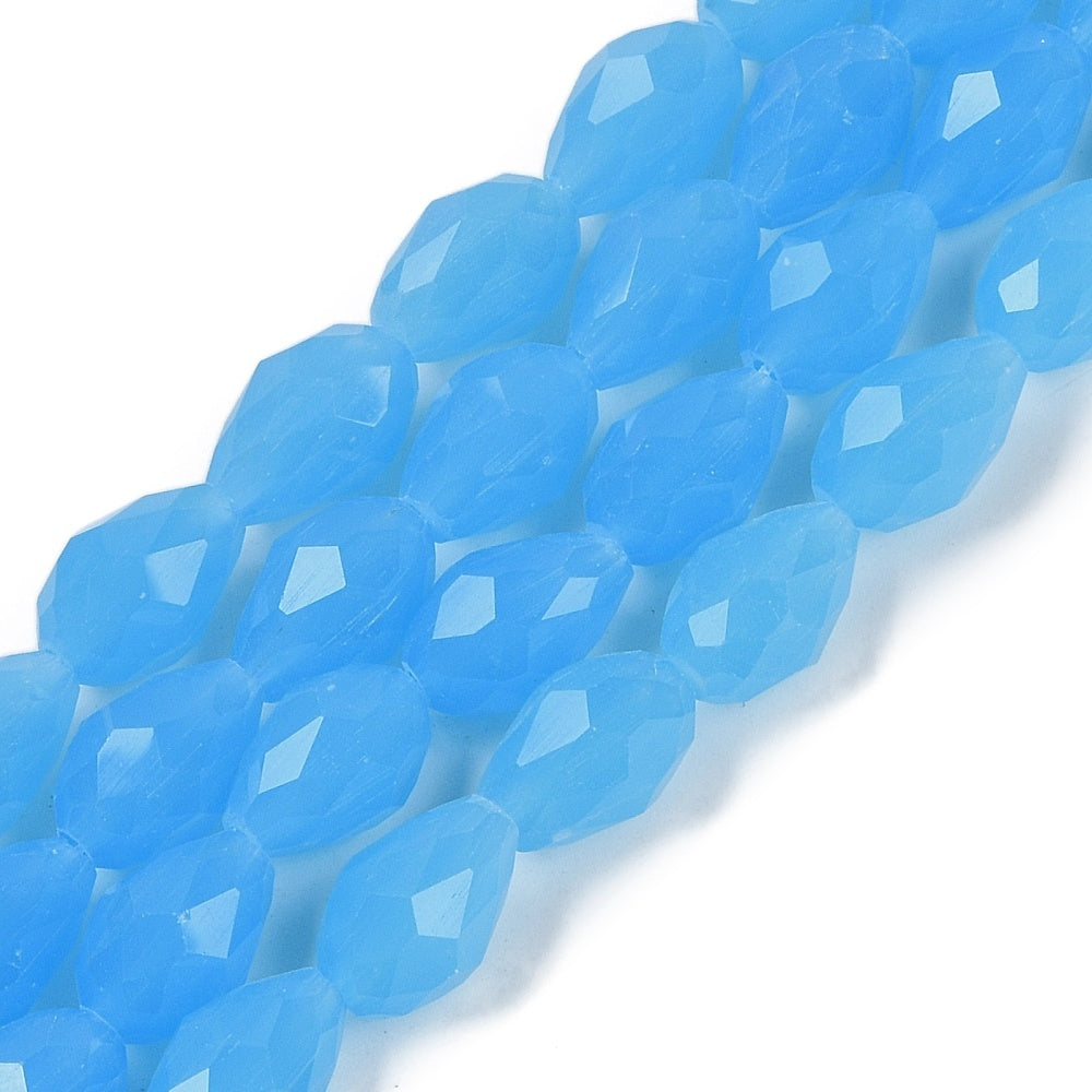 Blue faceted teardrop glass beads strand with reflective surfaces, close-up