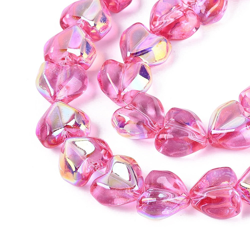 Heart glass beads, deep pink faceted AB electroplated hearts in a strand close-up