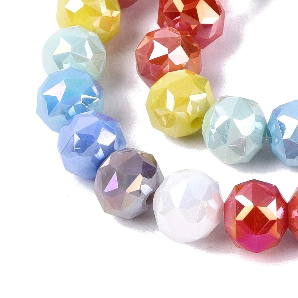 Faceted round glass beads, mixed blue, red, yellow, white, and pink in close-up