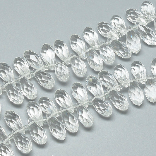 Clear faceted teardrop glass beads, drilled holes, close-up