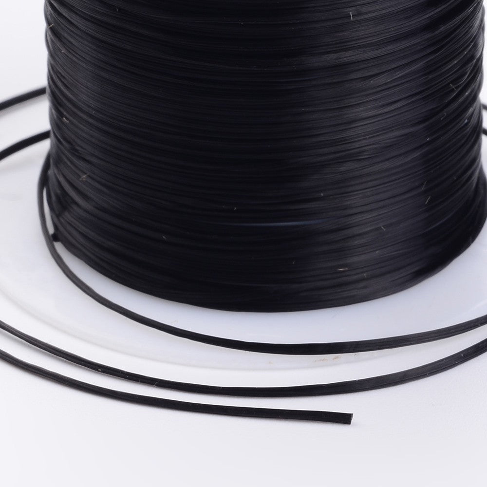 Black flat elastic cord strand from a spool, smooth stretch bracelet string