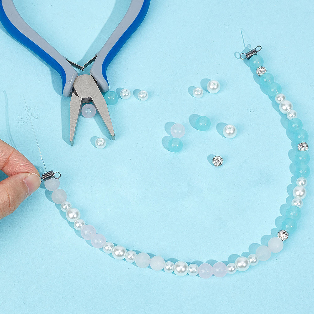 Gunmetal bead clamp connector on a pearl and light-blue beaded bracelet