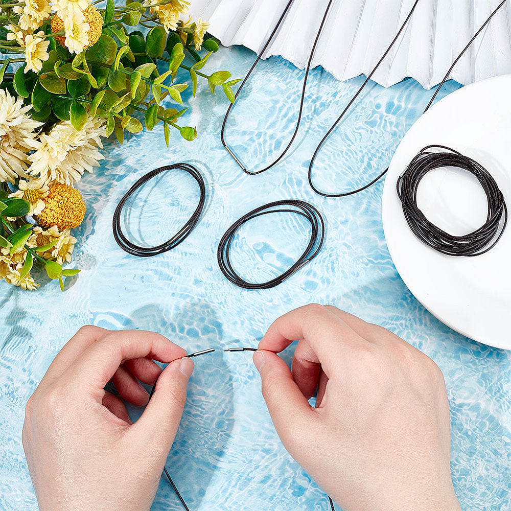 Braided waxed round cord with clasp, dark color, hands tying