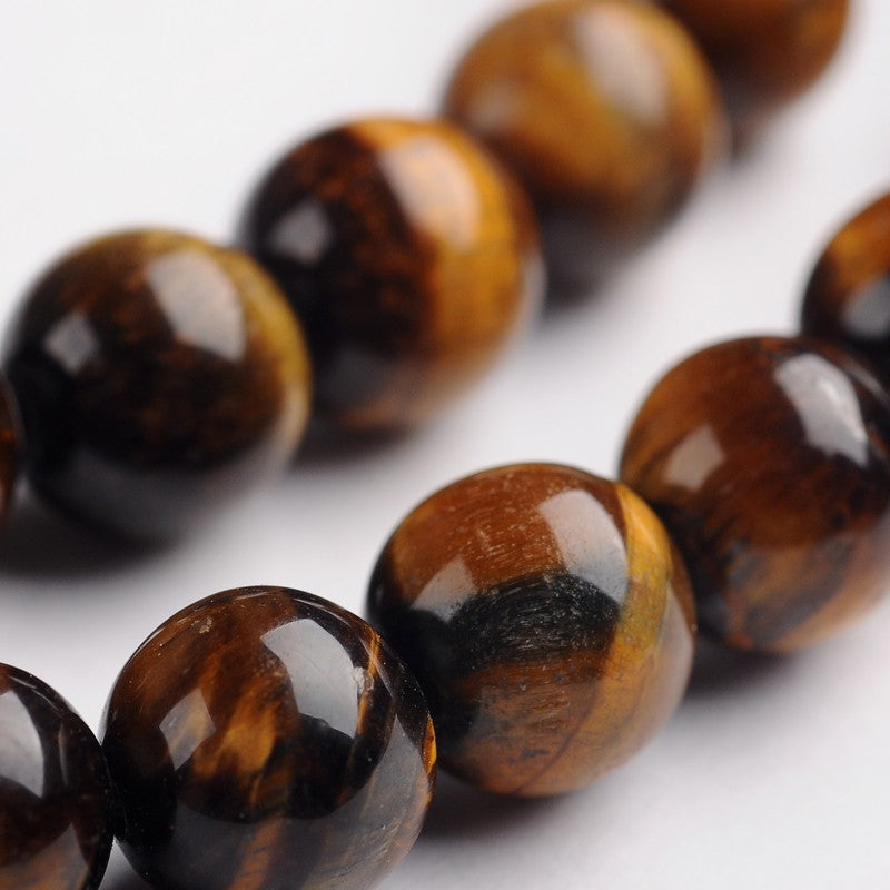 Round tiger eye gemstone beads, dark brown and amber with banded sheen